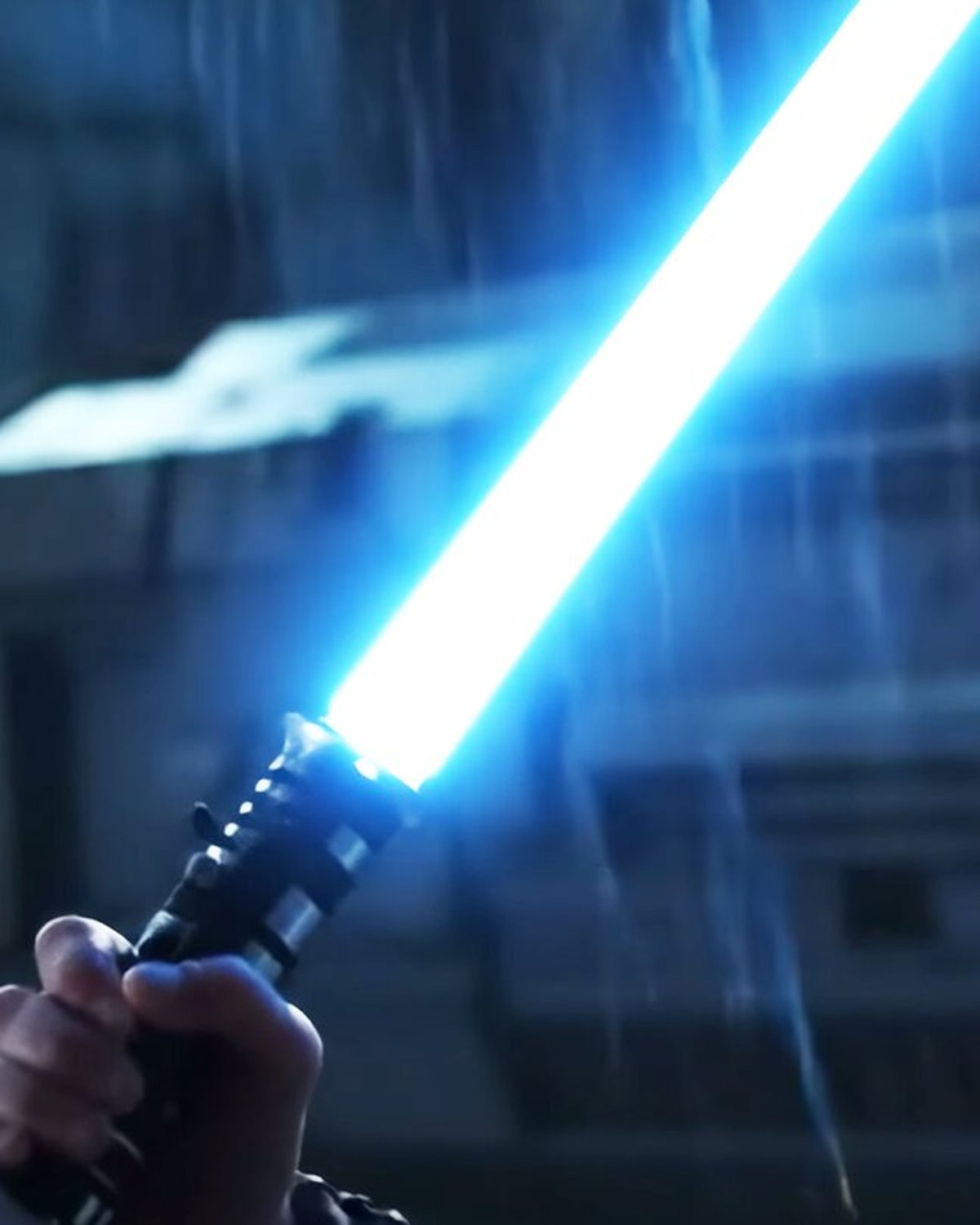 Featured image: a young Jedi with a blue lightsaber in the rain, from the AI-generated fan film 'Star Wars: The Ghost's Apprentice'