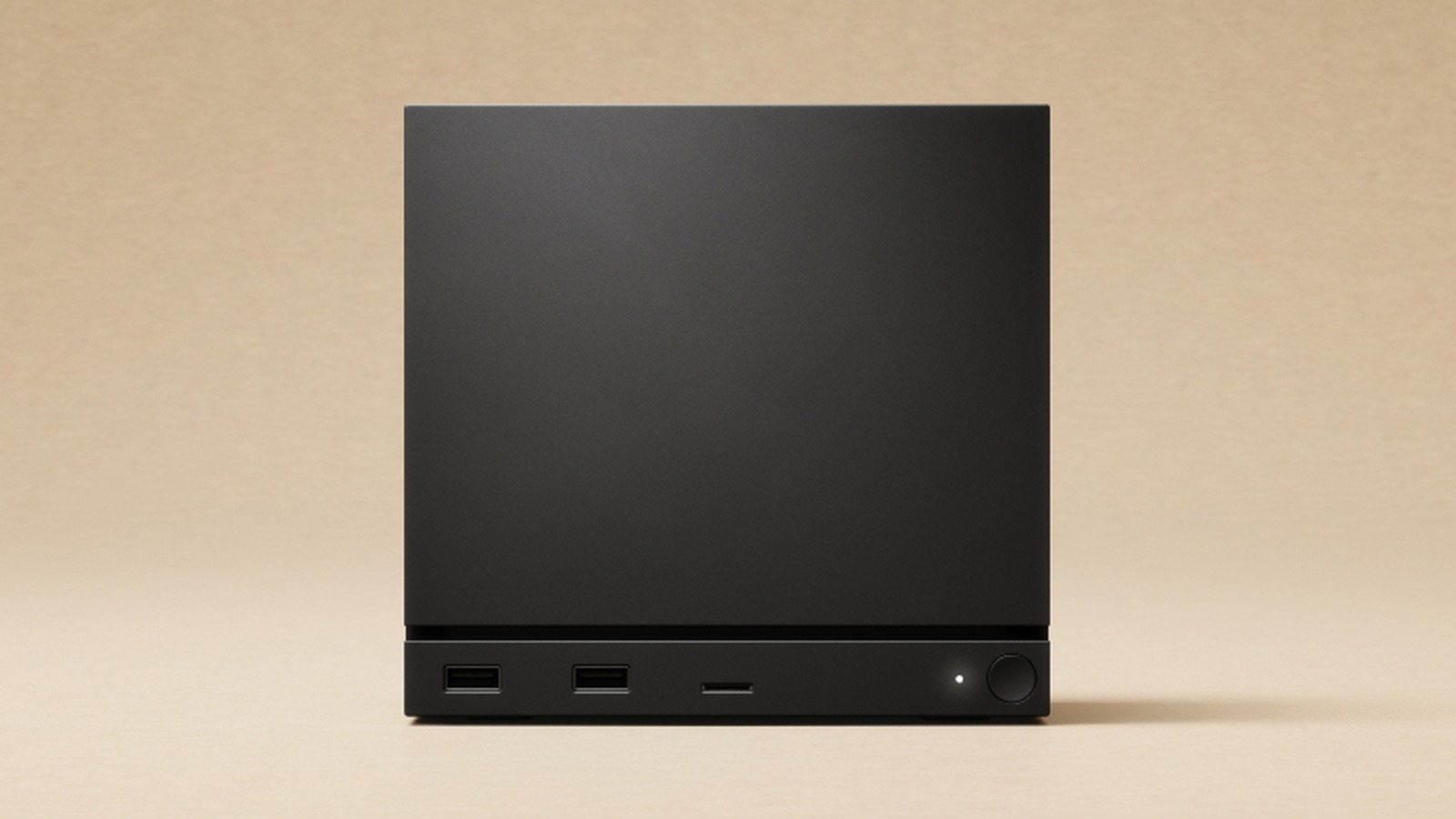 Valve's Steam Machine, a small black cube, on a media stand beneath a television