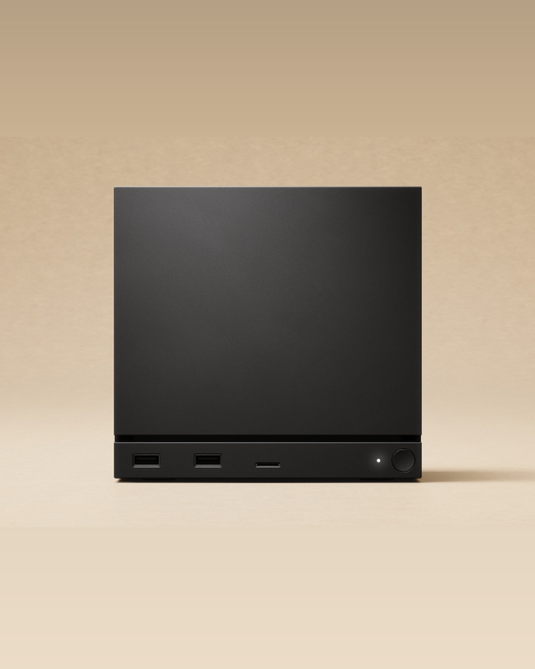 Valve's Steam Machine, a small black cube, on a media stand beneath a television