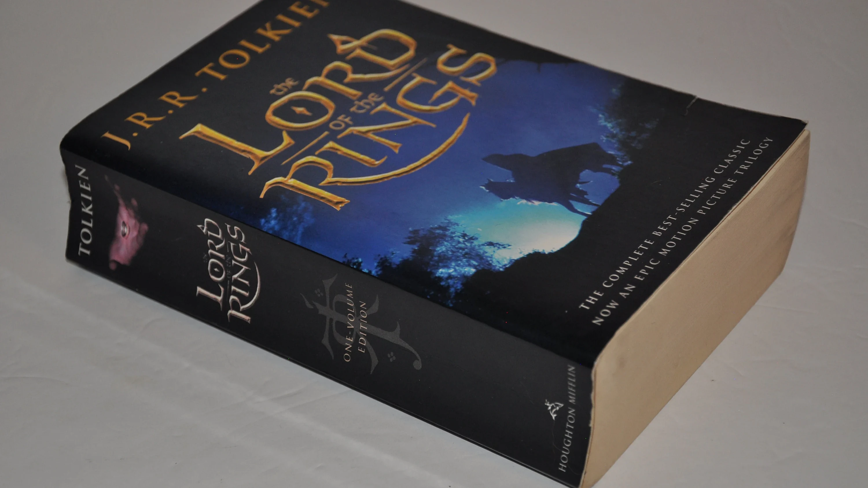 A worn paperback of The Lord of the Rings on a desk